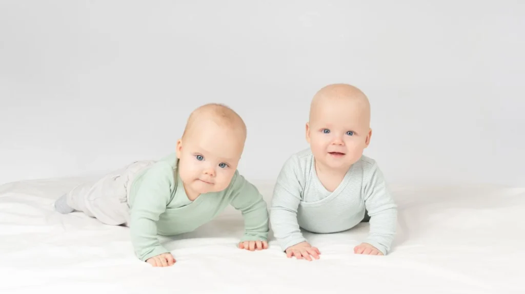 Top 20 Breastfeeding Tips for New Moms: Your Ultimate Guide to Success 10 Twin babies on a white background.